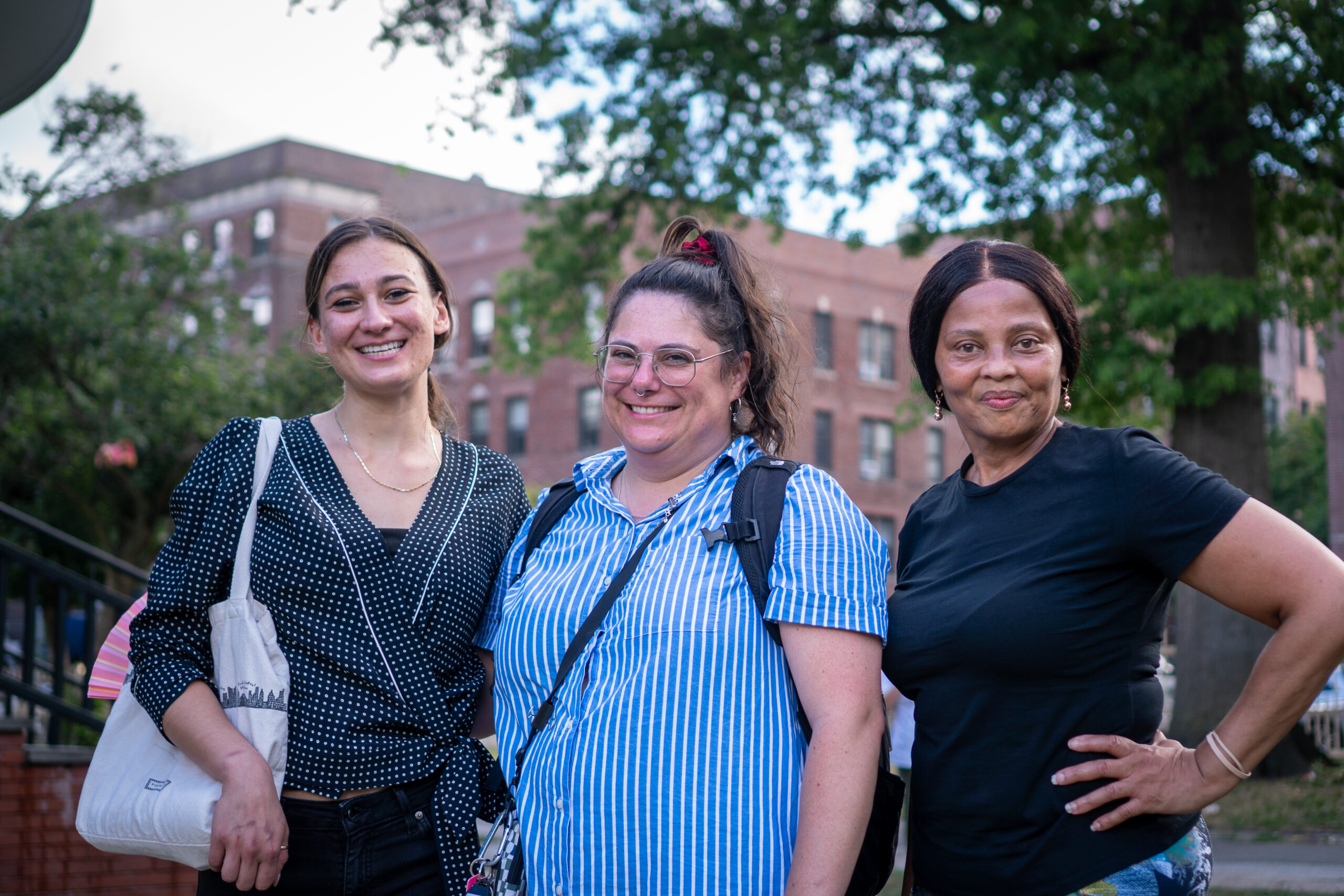 Three staff members stand together smiling at CFR's 2025 Family Fun Day event